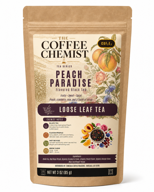 A 3 oz stand-up pouch of The Coffee Chemist Peach Paradise Flavored Black Tea, featuring a kraft paper design with detailed peach and floral illustrations on the label.