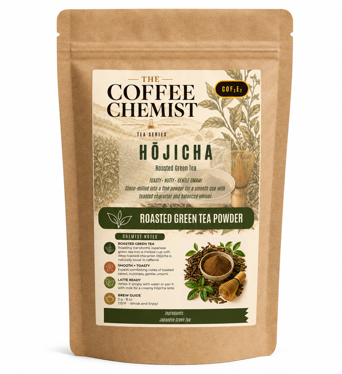 A stand-up kraft paper pouch of The Coffee Chemist Hōjicha Roasted Green Tea Powder, featuring a cream and green label with illustrations of tea plants and loose tea leaves.